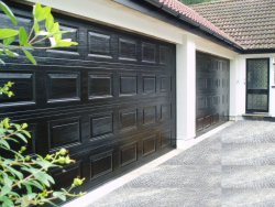 Pair of black finished georgian panelled sectional doors